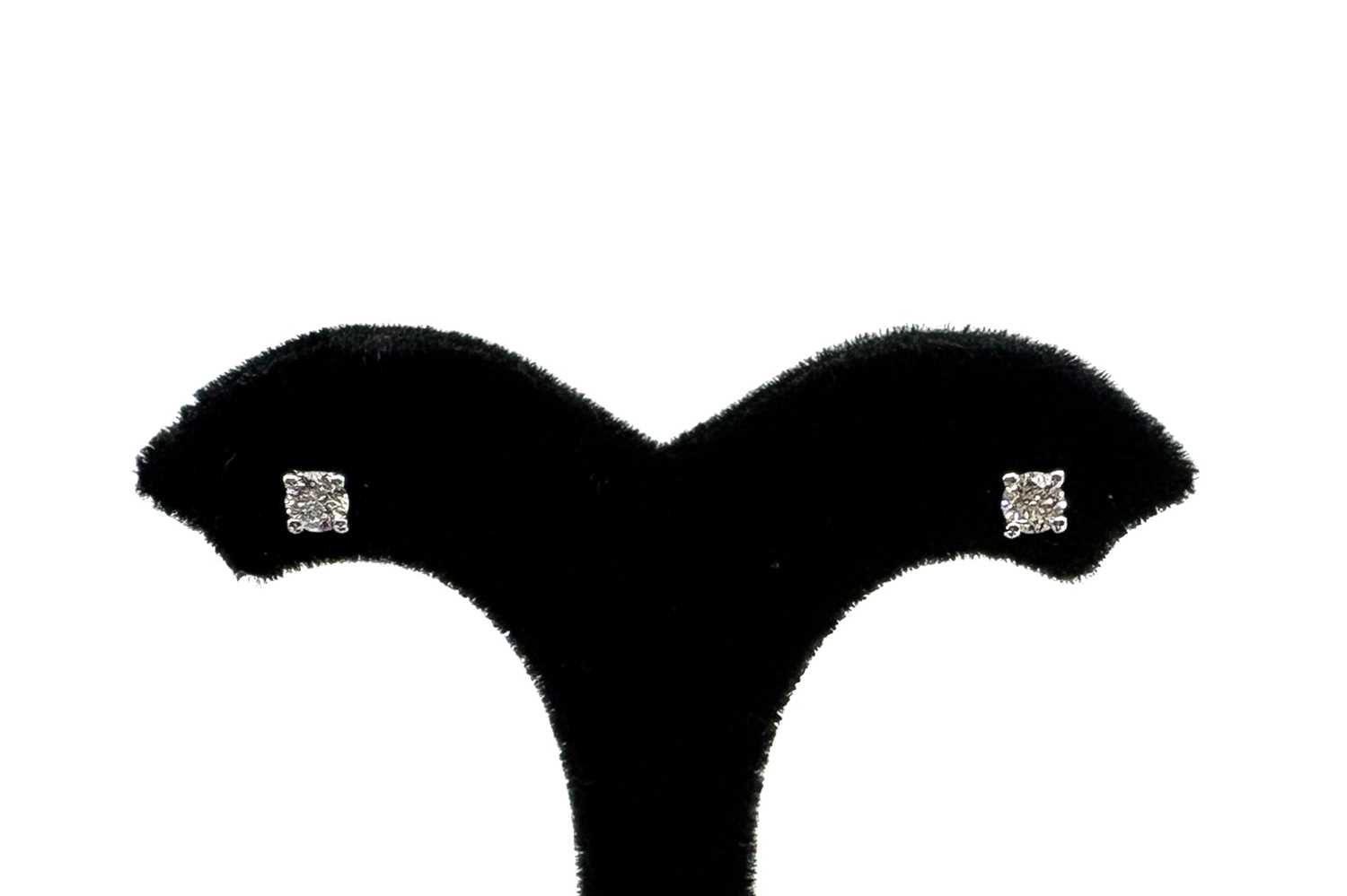 A PAIR OF DIAMOND STUD EARRINGS, the round...