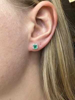 A PAIR OF EMERALD AND DIAMOND CLUSTER EARRINGS,...