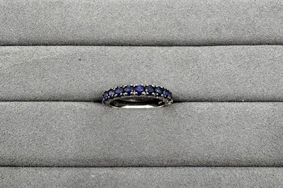 A SAPPHIRE HALF ETERNITY RING, the round...
