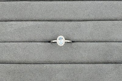 AN AQUAMARINE AND DIAMOND CLUSTER RING, the...