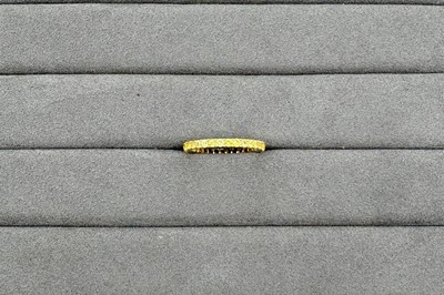 A YELLOW SAPPHIRE FULL ETERNITY RING, the...
