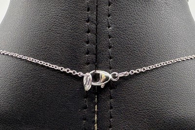 AN EMERALD SINGLE STONE PENDANT, the pear cut...