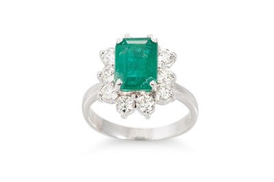 Lot 383 - AN EMERALD AND DIAMOND CLUSTER RING, the...
