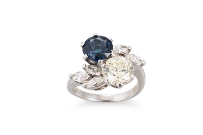 Lot 143 - A DIAMOND AND SAPPHIRE TWO STONE RING, of...