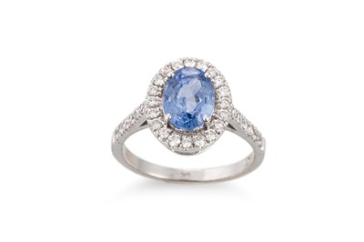 Lot 144 - A SAPPHIRE AND DIAMOND CLUSTER RING, the oval...