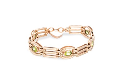 Lot 19 - A PERIDOT SET GATE BRACELET, with padlock...