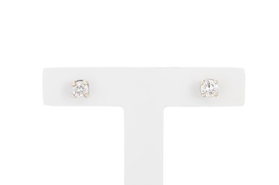 Lot 24 - A PAIR OF DIAMOND STUD EARRINGS, the round...