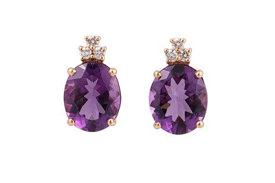 Lot 395 - A PAIR OF AMETHYST AND DIAMOND EARRINGS, oval...