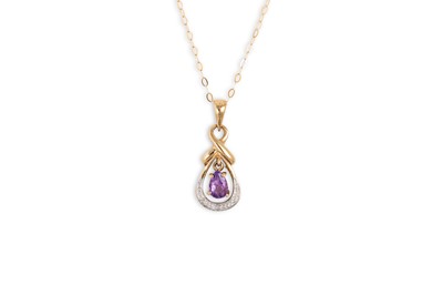 Lot 86 - AN AMETHYST AND DIAMOND SET PENDANT, the pear...