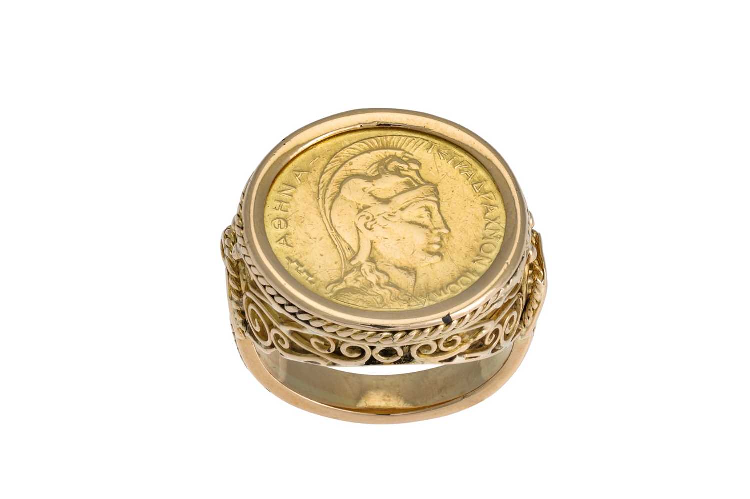 Lot 46 - A GENT'S GOLD COIN RING, of carved design, set...