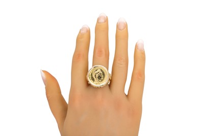 Lot 46 - A GENT'S GOLD COIN RING, of carved design, set...