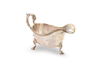 Lot 514 - A PRE-WAR STERLING SILVER HELMET SHAPED SAUCE...