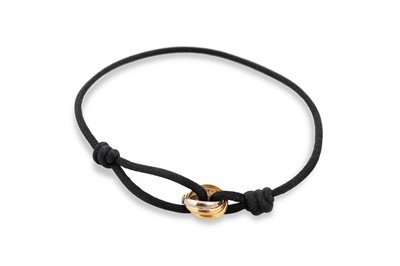 Lot 150 - A CARTIER TRINITY STRING BRACELET,...