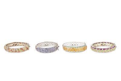 Lot 285 - FOUR SILVER MOUNTED GEM SET BANGLES