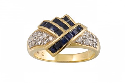 Lot 254 - A DIAMOND AND SAPPHIRE CROSSOVER RING, mounted...