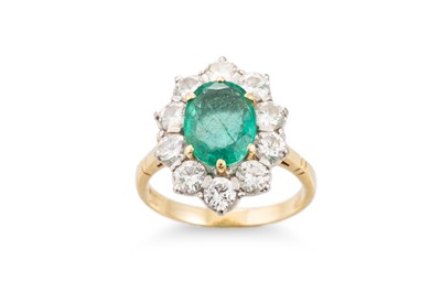 Lot 151 - AN EMERALD AND DIAMOND CLUSTER RING, the oval...