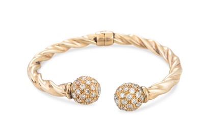 Lot 221 - A 9CT YELLOW OLD OPEN BANGLE, of twist form,...