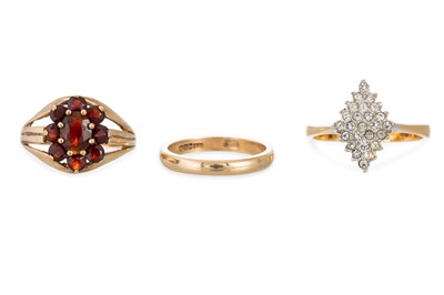 Lot 197 - THREE GOLD RINGS, to include a garnet cluster...