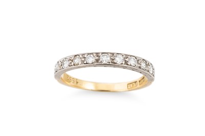 Lot 335 - A DIAMOND SET BAND RING, the round cut...