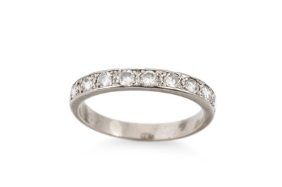 Lot 336 - A DIAMOND SET BAND RING, the round diamond...