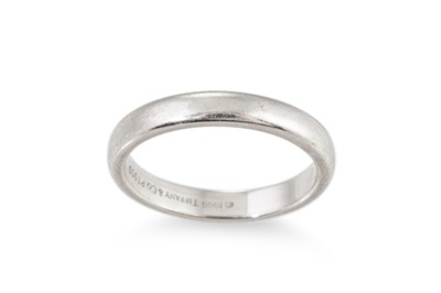 Lot 62 - A MODERN TIFFANY & CO. PLATINUM BAND RING,...