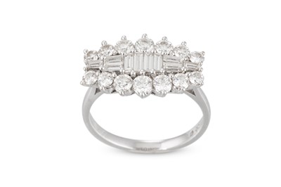 Lot 58 - A DIAMOND CLUSTER RING, set with baguette cut...
