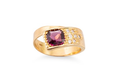 Lot 212 - A DIAMOND AND GARNET RING, of cross-over style,...