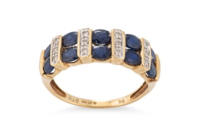 Lot 17 - A SAPPHIRE AND DIAMOND BAND RING, the two...