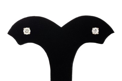 Lot 19 - A PAIR OF DIAMOND STUD EARRINGS, the round...