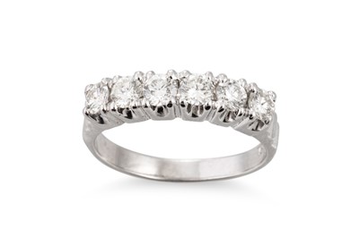 Lot 74 - A SIX STONE DIAMOND RING, the brilliant cut...