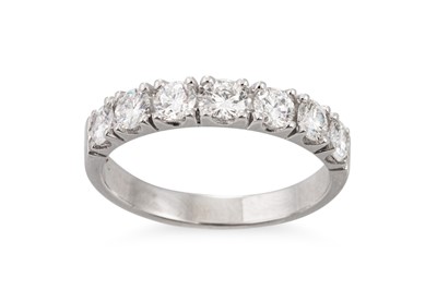 Lot 77 - A SEVEN STONE DIAMOND RING, the brilliant cut...