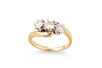 Lot 350 - A THREE STONE DIAMOND RING, of twist design,...