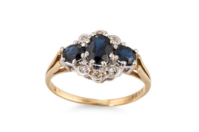 Lot 130 - A SAPPHIRE AND DIAMOND CLUSTER RING, the oval...