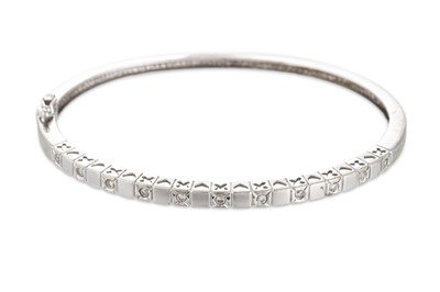 Lot 109 - A DIAMOND SET BANGLE, mounted in 14ct white...