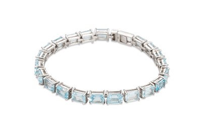 Lot 115 - A TOPAZ SET LINE BRACELET, mounted in .925...