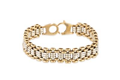 Lot 184 - A 9CT TWO TONE FLEXIBLE BRACELET, 23 g.