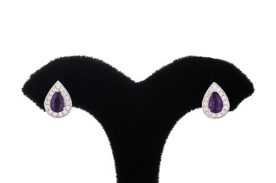 Lot 84 - A PAIR OF DIAMOND AND AMETHYST CLUSTER...