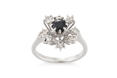 Lot 117 - A DIAMOND AND SAPPHIRE CLUSTER RING, mounted...