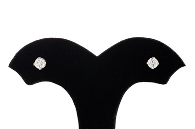 Lot 127 - A PAIR OF DIAMOND STUD EARRINGS, one brilliant...