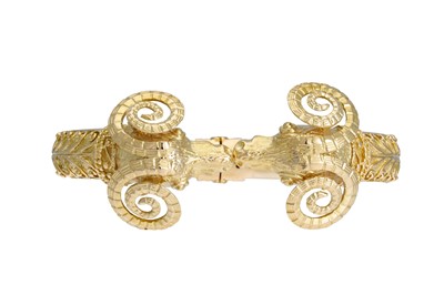 Lot 51 - AN 18CT GOLD HINGED BANGLE, modelled as twin...