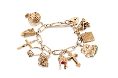 Lot 197 - A 9CT GOLD CHARM BRACELET, various charms...