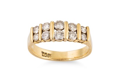 Lot 211 - A DIAMOND SET BAND RING, the round brilliant...