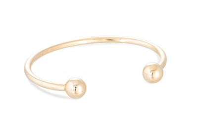 Lot 308 - A 9CT YELLOW GOLD BANGLE, openwork form with...