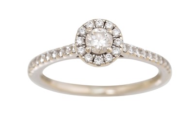 Lot 282 - A DIAMOND HALO CLUSTER RING, the centre...