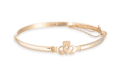 Lot 322 - A 9CT GOLD CLADDAGH BANGLE, 10.8 g.