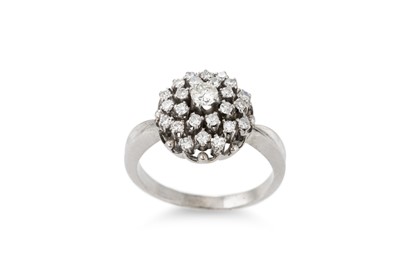 Lot 296 - A DIAMOND CLUSTER RING, in bombé form, the...