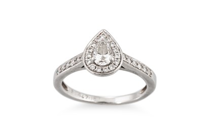 Lot 2 - A PEAR SHAPED DIAMOND CLUSTER RING, mounted in...