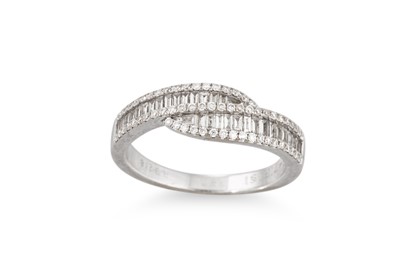 Lot 3 - A CHANNEL SET DIAMOND CROSS-OVER RING, mounted...