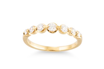 Lot 208 - A SEVEN STONE DIAMOND RING, the brilliant cut...