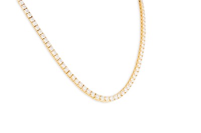 Lot 224 - A DIAMOND LINE NECKLACE, the slightly...